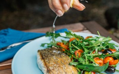 Warm barramundi salad with tomatoes, capers and olives